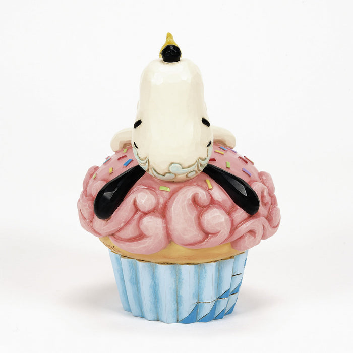 Snoopy Laying on Cupcake