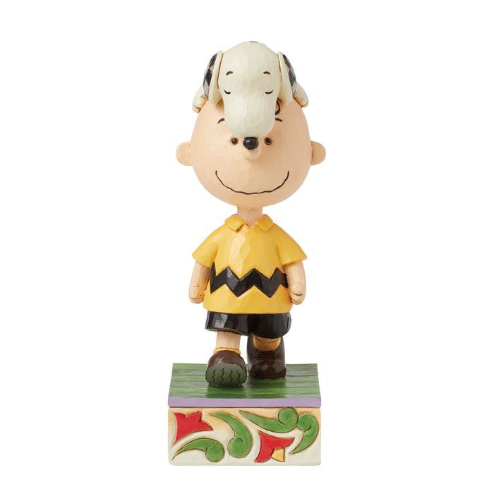 Snoopy on Charlie Brown's Head