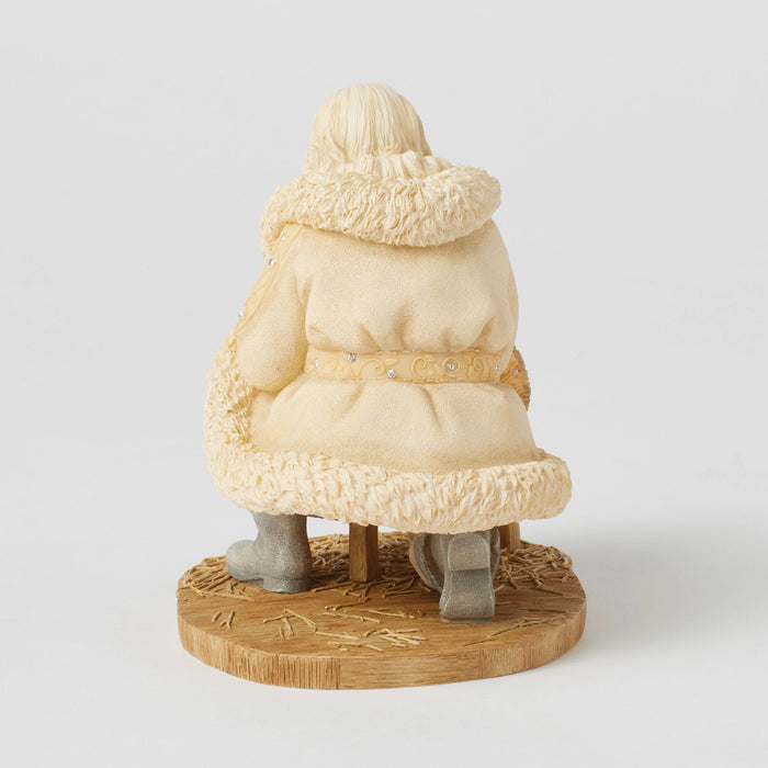 Santa with baby Jesus figurine