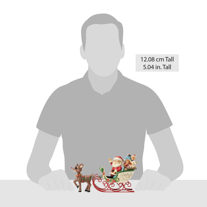 Rudolph Pulling Santa in Sled