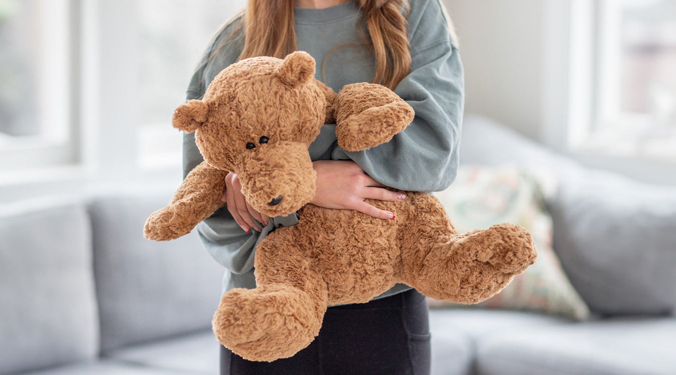 Child holding boyds bears