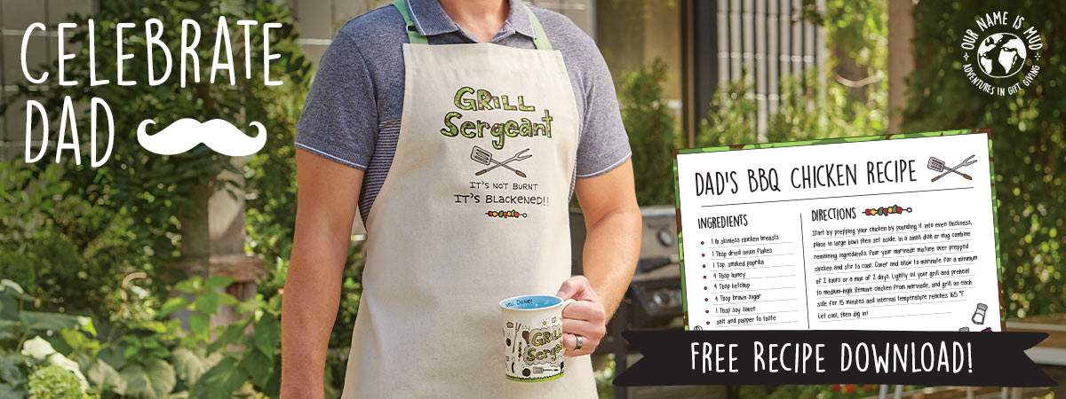 Man wearing apron and holding mug