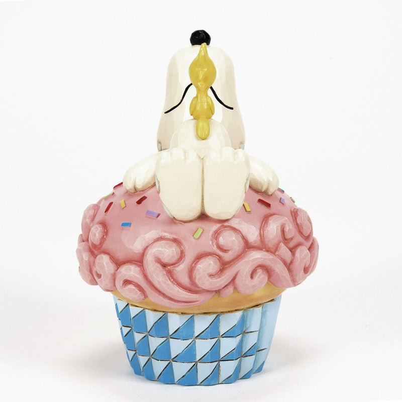 Snoopy Laying on Cupcake