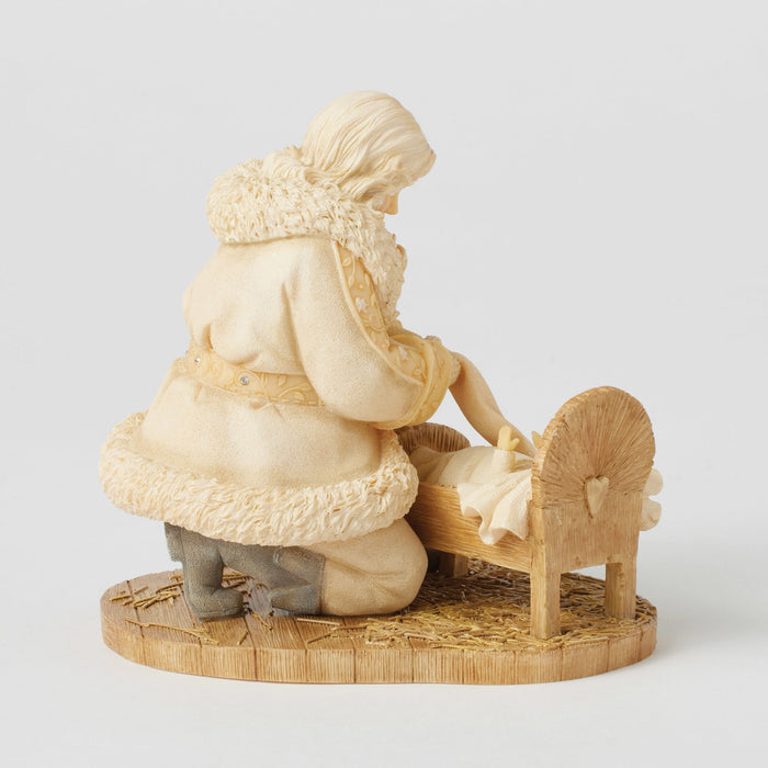 Santa with baby Jesus figurine