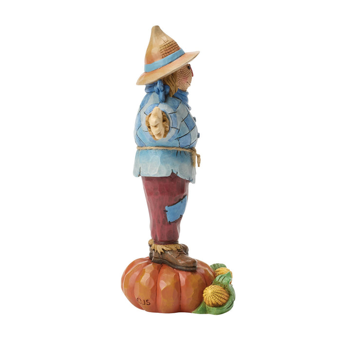 Scarecrow Standing on Pumpkin