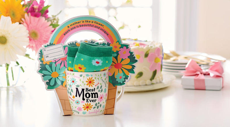 Greeting card with flowers, mug, and socks on a table with a floral background