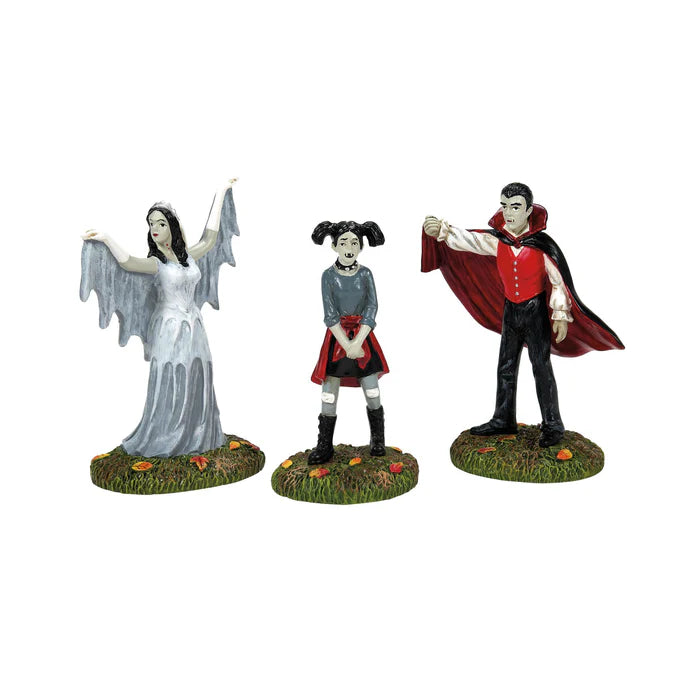 Three Halloween-themed figurines on a white background